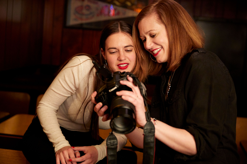 Donna and Ariel check out some shots.